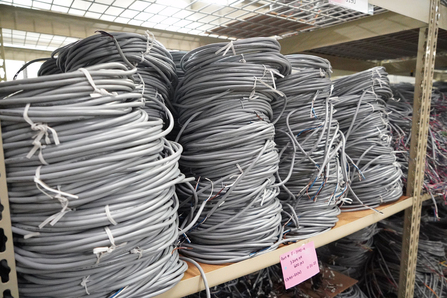 Wire stacked in coils on warehouse rack